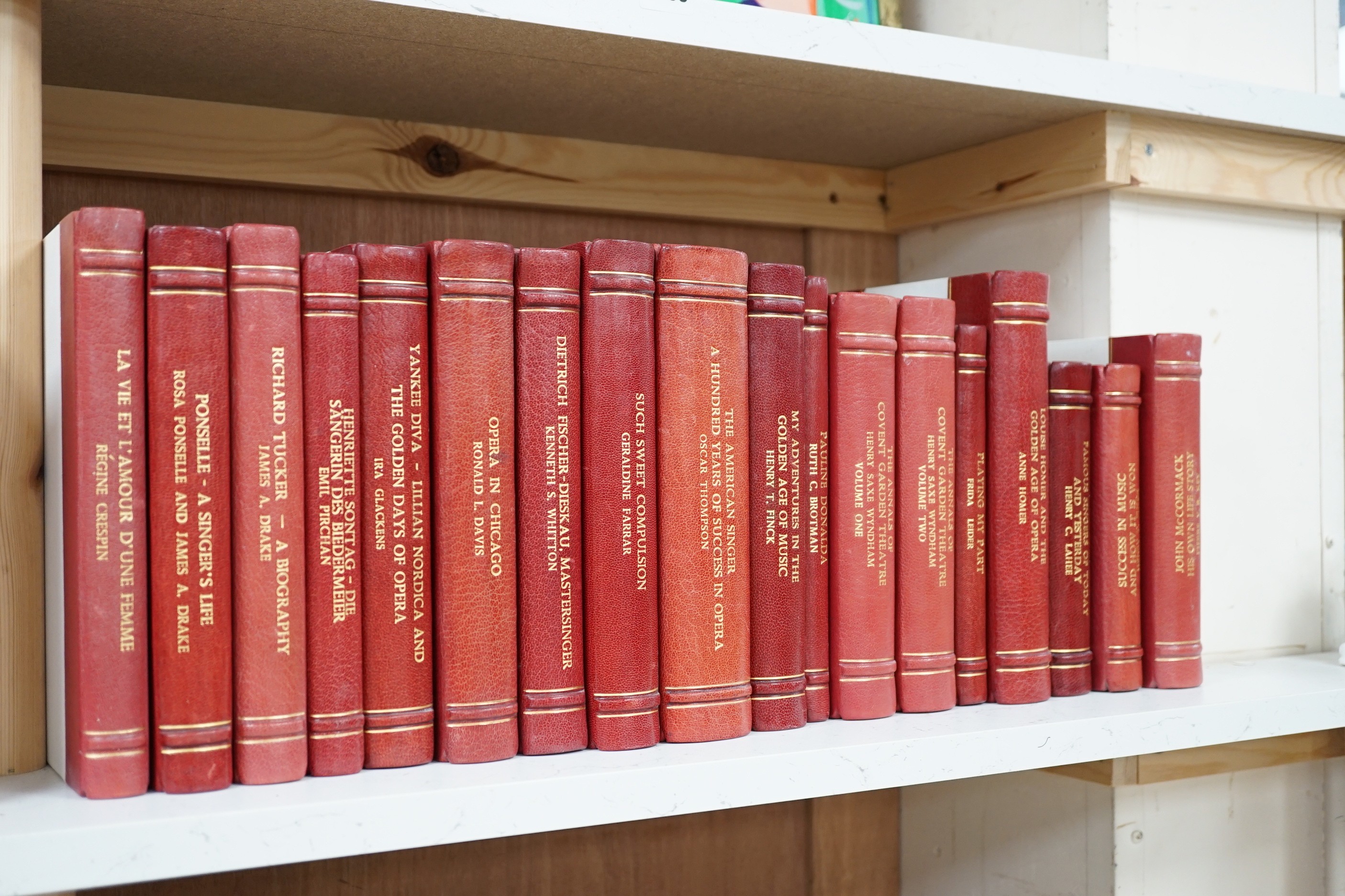 A collection of 19th and 20th century works on opera related biographies, autobiographies and histories, bound in red morocco by EA Weeks, London, one signed by the author, approx. 69 in total. Please note :- A SIMILAR L